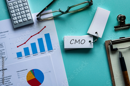 There is word card with the word CMO. It is an abbreviation for Chief Marketing Officer as eye-catching image. photo