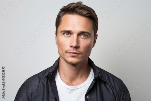 Portrait of handsome young man in casual clothes. Studio shot.
