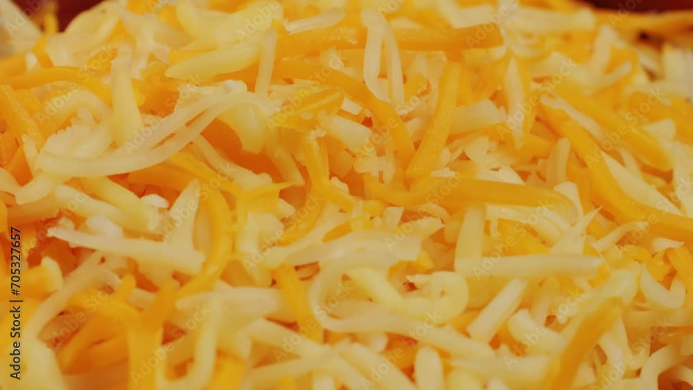 Some different sorts of grate cheese on plate close up macro. Chef grating cheese mozzarella, cheddar for meals. Itallian food, pizza, pasta. Some different sorts of grate cheese on plate close up macro. Chef grating cheese mozzarella, cheddar for meals. Itallian food, pizza, pasta.