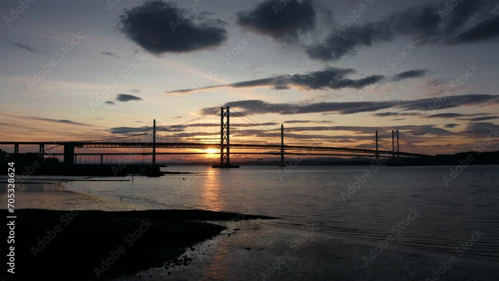 Aerial sunset panoramic view of Forth Bridge Scotland United Kingdom, dramatic clouds Aerial sunset panoramic view of Forth Bridge Scotland United Kingdom, dramatic clouds