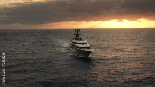 Wallpaper Mural Luxury expensive yacht sailing in the ocean during sunrise, aerial horizon view with dramatic clouds Torontodigital.ca