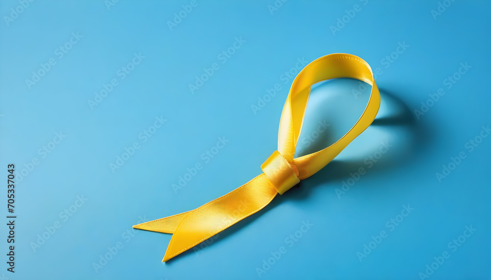 Childhood Cancer Awareness Yellow Ribbon on blue background with space for copy for world cancer day 4 feb concept created with generative ai - obrazy, fototapety, plakaty 