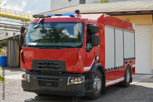 A state-of-the-art firetruck  equipped with advanced rescue technology  stands ready with its skilled firefighting team  prepared to intervene and respond rapidly to emergencies  ensuring the safety