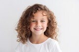 Portrait of a cute little girl with curly hair on white background