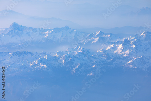 Aerial view of the Himalayas with snow capped peaks . Aerial winter scenery with mountains © russieseo