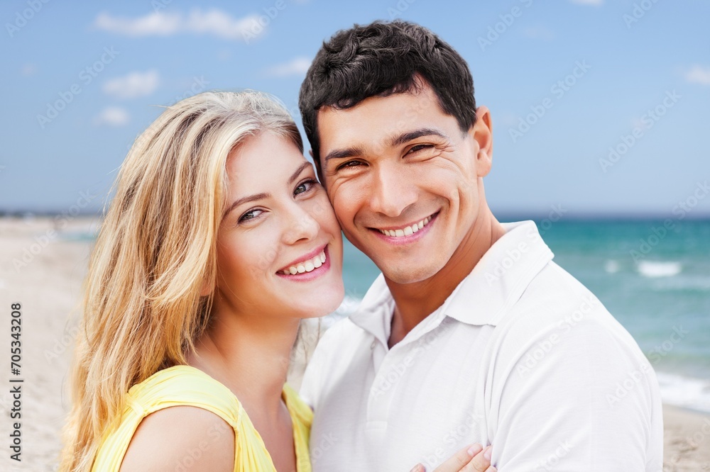 Young diverse couple have fun together at the beach Young diverse couple have fun together at the beach