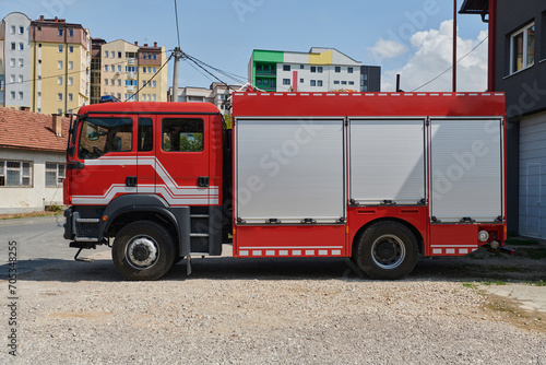 A state-of-the-art firetruck, equipped with advanced rescue technology, stands ready with its skilled firefighting team, prepared to intervene and respond rapidly to emergencies, ensuring the safety