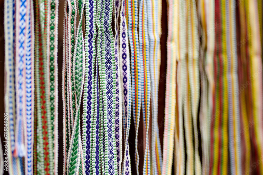 Obraz na płótnie Details of a traditional colorful Lithuanian weave. Woven belts as a part of national Lithuanian costume sold on traditional Easter fair in Vilnius w salonie