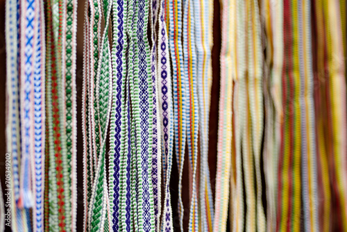 Details of a traditional colorful Lithuanian weave. Woven belts as a part of national Lithuanian costume sold on traditional Easter fair in Vilnius