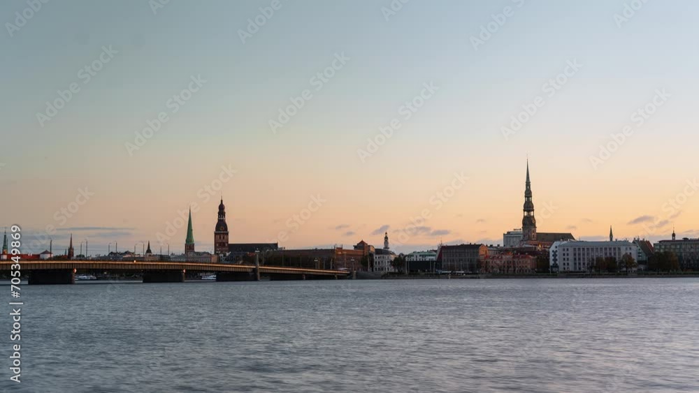 Riga old town panoramic timelapse at sunrise with St Peters and Dome church in the background Riga old town panoramic timelapse at sunrise with St Peters and Dome church in the background