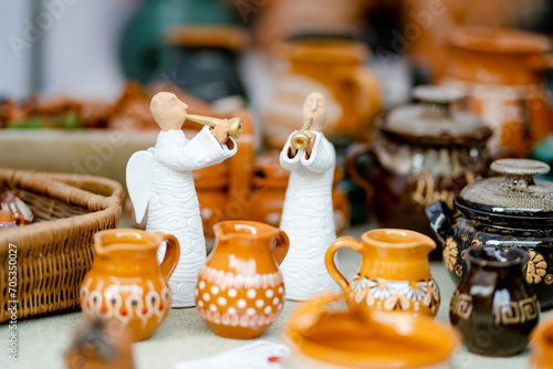 Ceramic dishes, tableware and jugs sold on Easter market in Vilnius. Lithuanian capital's annual traditional crafts fair is held on Old Town streets. © MNStudio
