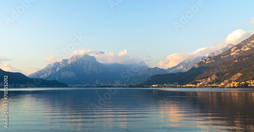 Mountain landscape, picturesque mountain lake in the summer morning, large panorama, landscape with fabulous lake view from the top of the mountain, with view of city. © photo-lime