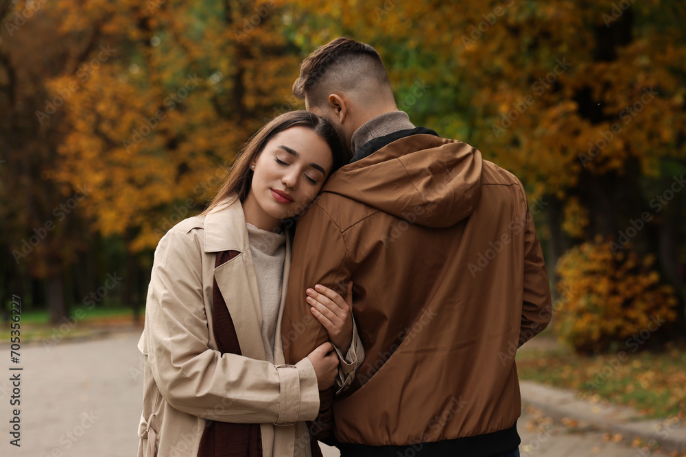 Fototapeta premium Happy young couple spending time together in autumn park