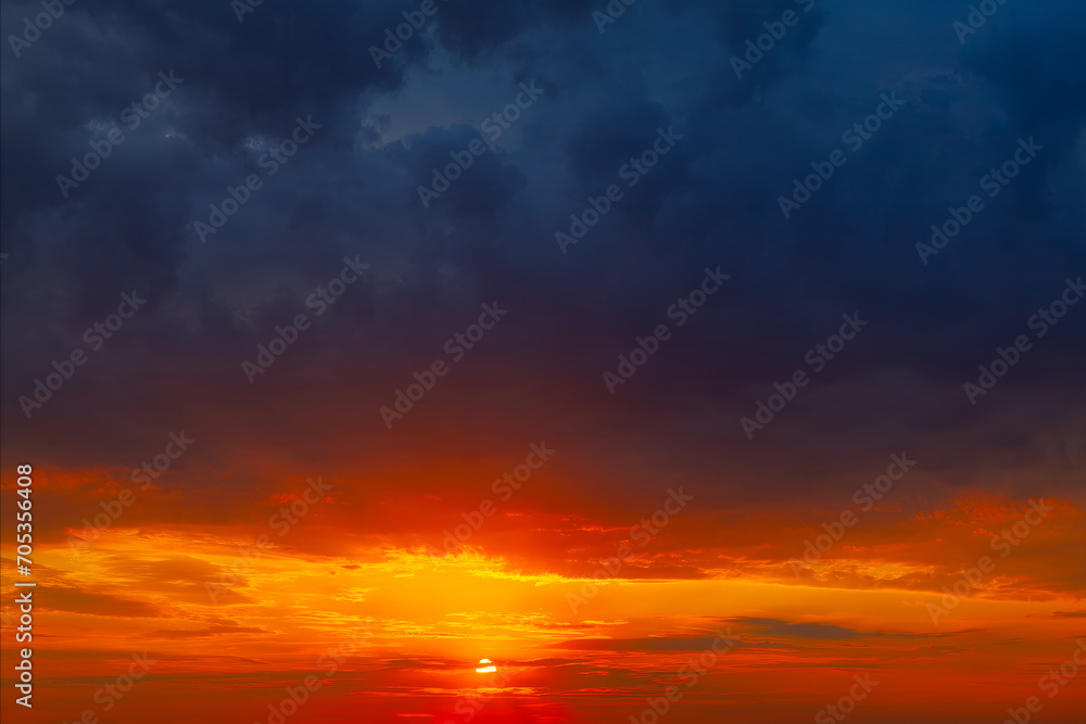 Colorful dramatic sky with blue clouds at sunset. Sky background