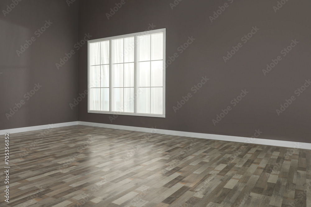 Obraz premium Empty room with brown walls and large window