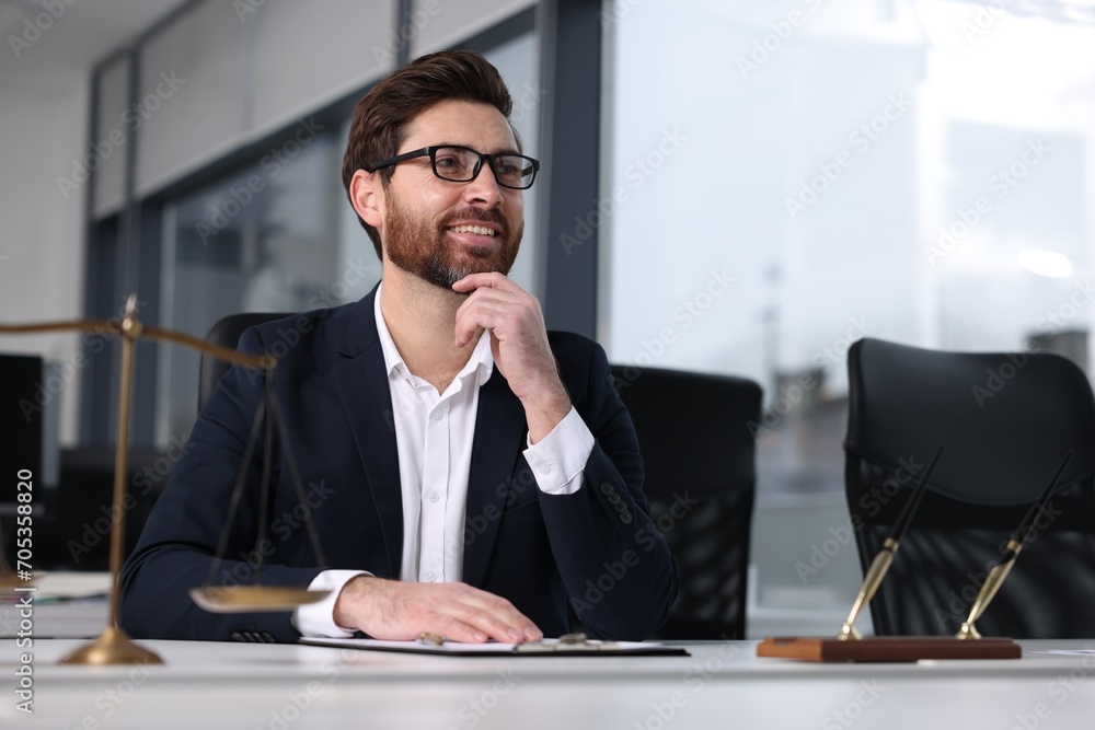 Smiling lawyer at table in office, space for text Smiling lawyer at table in office, space for text