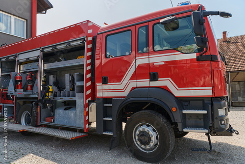 A state-of-the-art firetruck, equipped with advanced rescue technology, stands ready with its skilled firefighting team, prepared to intervene and respond rapidly to emergencies, ensuring the safety