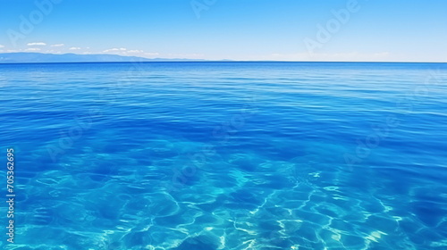 A calm, serene, wide blue sea landscape bordering the blue sky. Generative AI