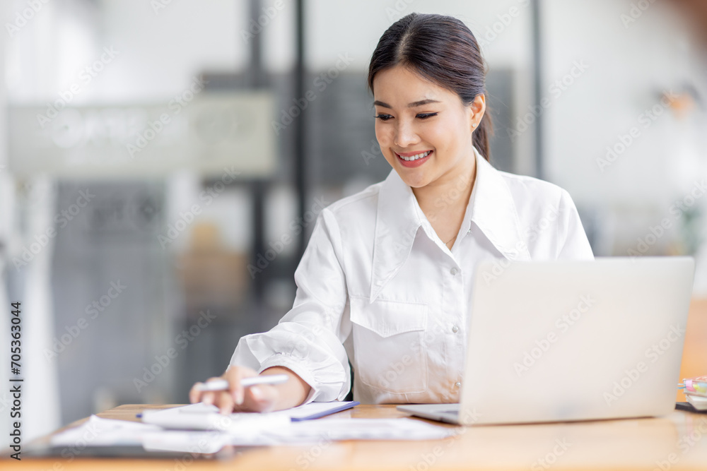 Asian Business woman work in the office. concept of tax, report, accounting, statistics, and analytical research. Asian Business woman work in the office. concept of tax, report, accounting, statistics, and analytical research.