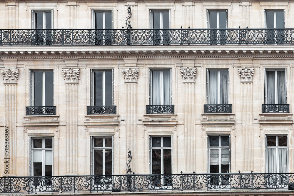 Detail of the facade with windows of a building in Paris, France