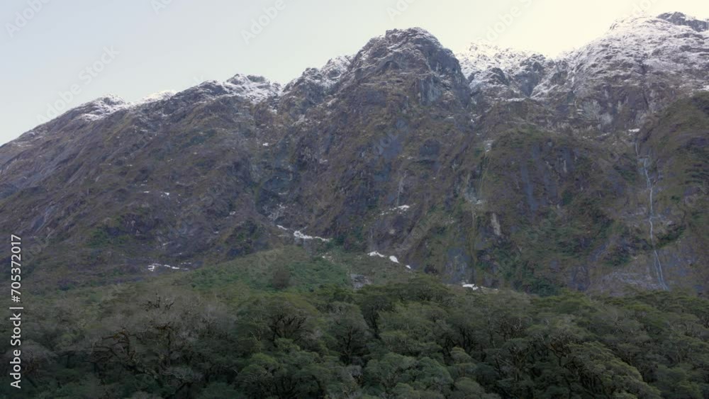 A hillside with many waterfalls taken on the way to the Milford Sound in New Zealand A hillside with many waterfalls taken on the way to the Milford Sound in New Zealand