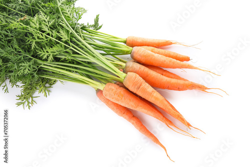 Fresh carrots with leaves isolated on white background photo