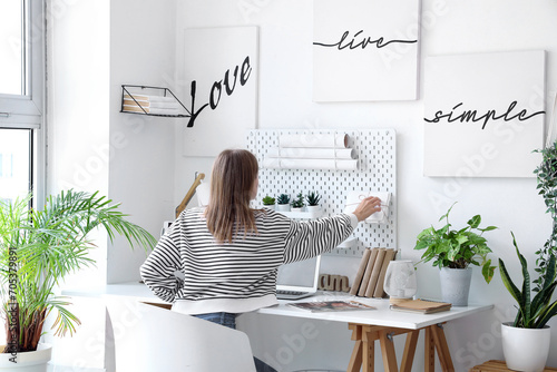 Young woman working at desk...