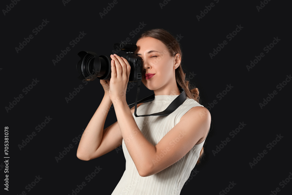 Female photographer with camera in studio Female photographer with camera in studio