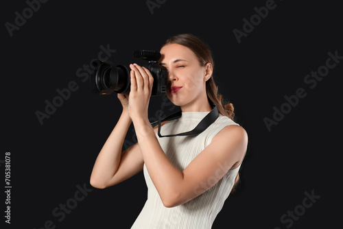 Female photographer with ca...