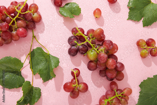 Tasty ripe grapes with leav...