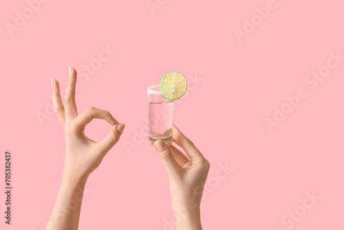 Female hands holding shot o...