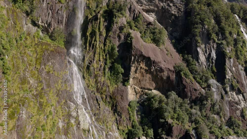 A Small Waterfall in the Milford Sound, New Zealand A Small Waterfall in the Milford Sound, New Zealand