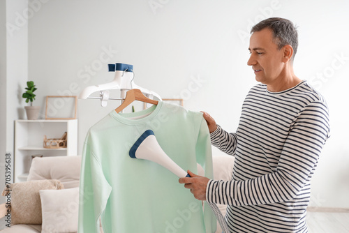 Mature man steaming sweatsh...