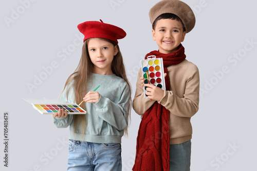 Cute little artists with pa...