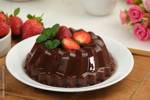 Chocolate pudding or puding coklat with strawberry delicious sweet dessert on white background