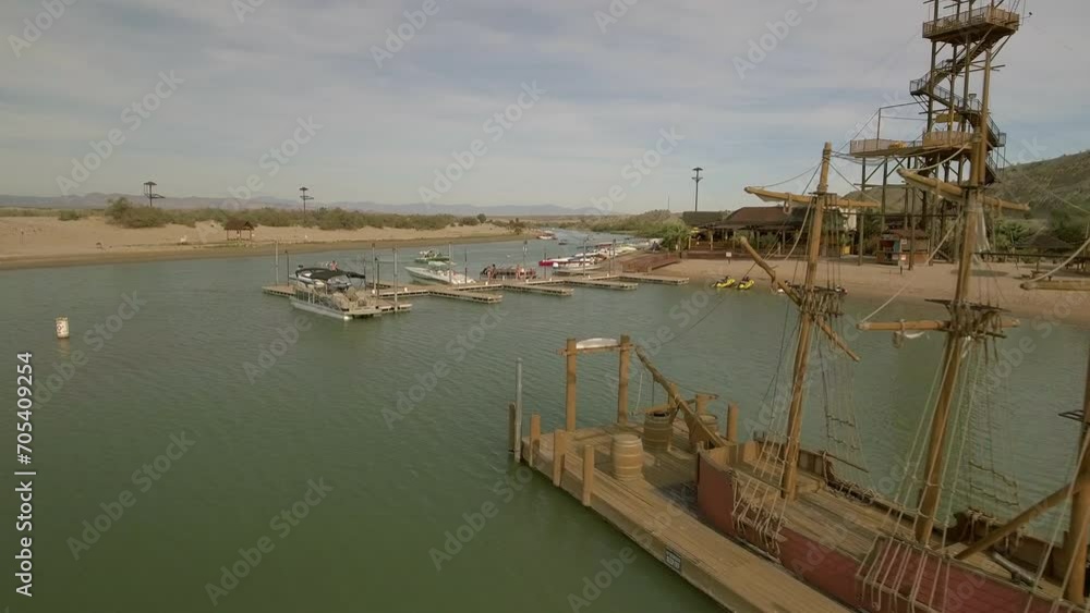 Aerial: Drone Forward Shot Of Pirate Ship Moored On Rippled Sea - Magdalena Bay, Mexico Aerial: Drone Forward Shot Of Pirate Ship Moored On Rippled Sea - Magdalena Bay, Mexico