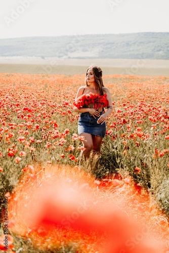 Fototapeta Naklejka Na Ścianę i Meble -  Woman poppies field. portrait happy woman with long hair in a poppy field and enjoying the beauty of nature in a warm summer day.