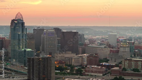 Wallpaper Mural Cincinnati city in Ohio with brightly illuminated high skyscraper buildings in downtown district. American megapolis with business financial district at sunset Torontodigital.ca