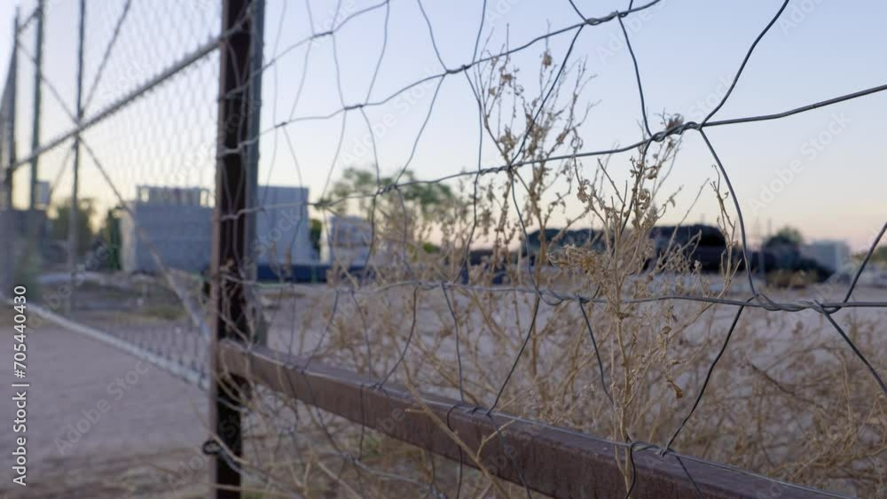 Wire fence with dry dead weeds in Australian outback town Wire fence with dry dead weeds in Australian outback town