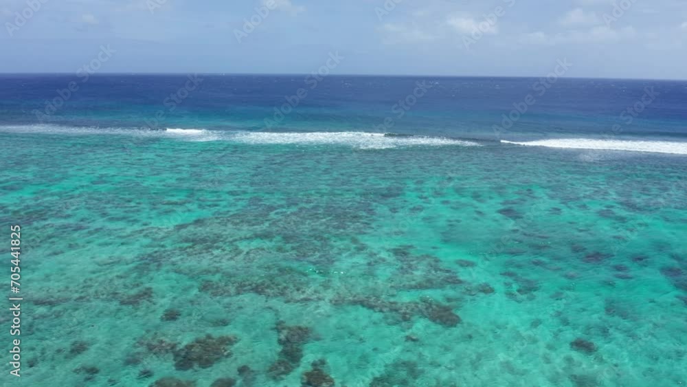 Tonga, Polynesia. Aerial View of Pacific Ocean Waves Breaking on Coral Reefs, Tropical Paradise, Drone Shot Tonga, Polynesia. Aerial View of Pacific Ocean Waves Breaking on Coral Reefs, Tropical Paradise, Drone Shot