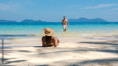 Koh Wai Island Trat Thailand is a tinny tropical Island near Koh Chang. a young couple of men and women on a tropical beach during a luxury vacation in Thailand