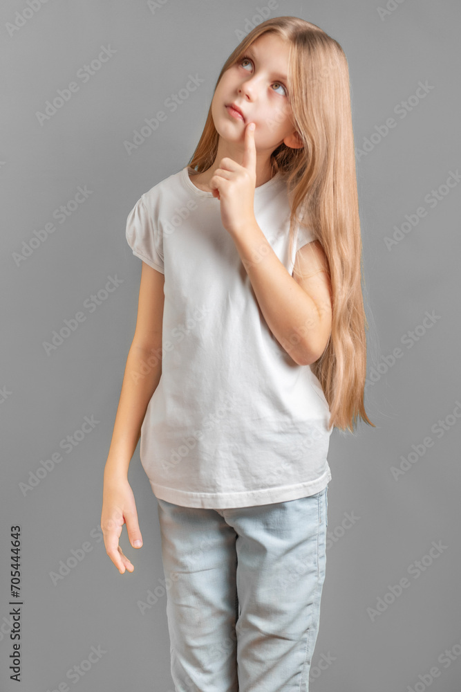 A thoughtful girl with long blond hair A thoughtful girl with long blond hair