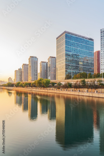 The modern urban architecture skyline and ancient canal scenery of Beijing, the capital of China © q