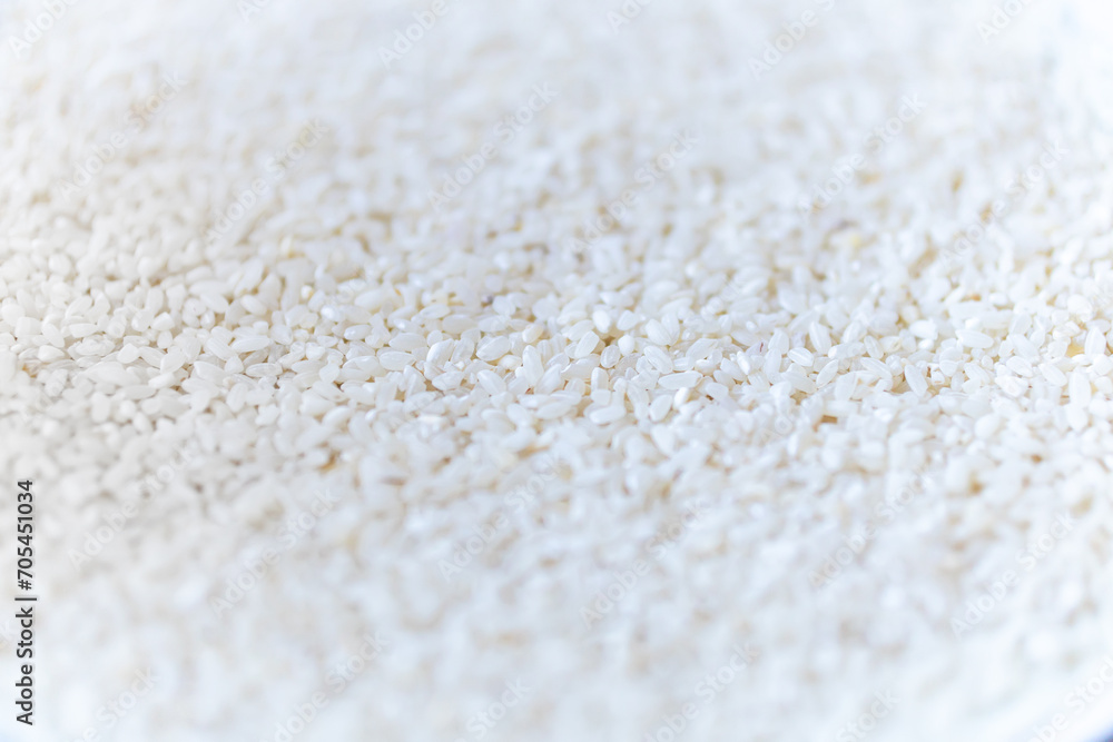 White long rice background, uncooked raw cereals, macro, closeup, low depth of field White long rice background, uncooked raw cereals, macro, closeup, low depth of field