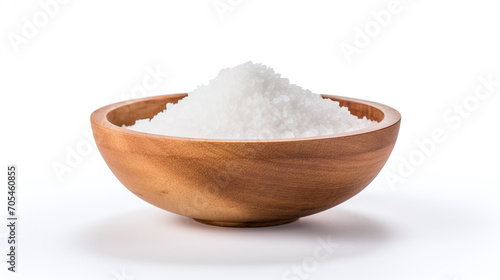 Salt in a wooden bowl isolated on white.