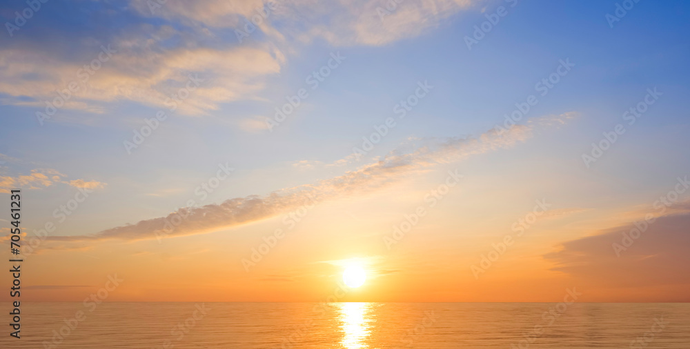 Majestic golden sunrise sky over sea with beautiful cloud and yellow sunlight reflection on water surface in the morning, Idyllic natural sunset seascape panoramic view background Majestic golden sunrise sky over sea with beautiful cloud and yellow sunlight reflection on water surface in the morning, Idyllic natural sunset seascape panoramic view background