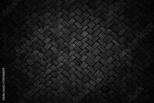 Old black bamboo weave texture background, pattern of woven rattan mat in vintage style. photo
