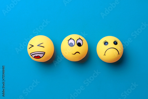 Sad, neutral and happy emotion faces on blue background. 