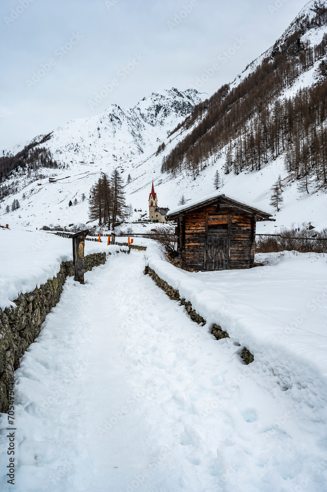 Church of Santo Spirito immersed in the snow of Val Aurina