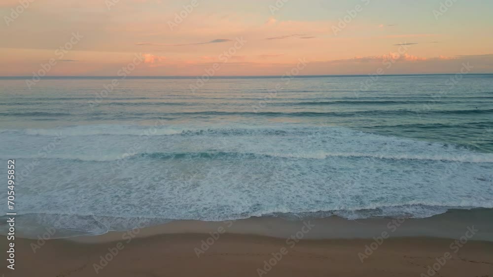 Orange sunset ocean horizon over foamy waves aerial view. Surf rolling coast Orange sunset ocean horizon over foamy waves aerial view. Surf rolling coast